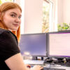 Team Infrastructure Staff Working on the PC