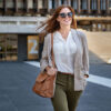 Woman with sunglasses and handbag over her shoulder