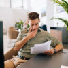Man reads the contract templates from onOffice
