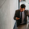 Man uses the onOffice app on his smartphone