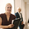 Woman with clipboard in hand